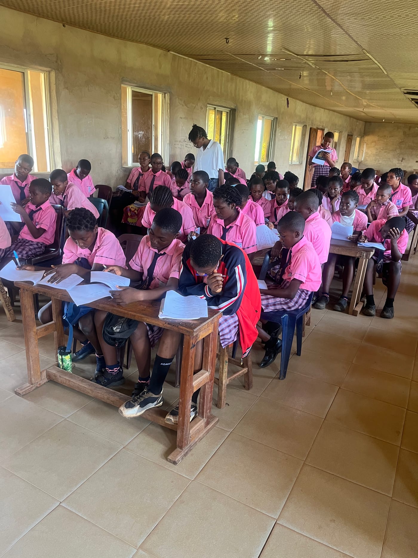 Students following a Her Path to Power session at their desks